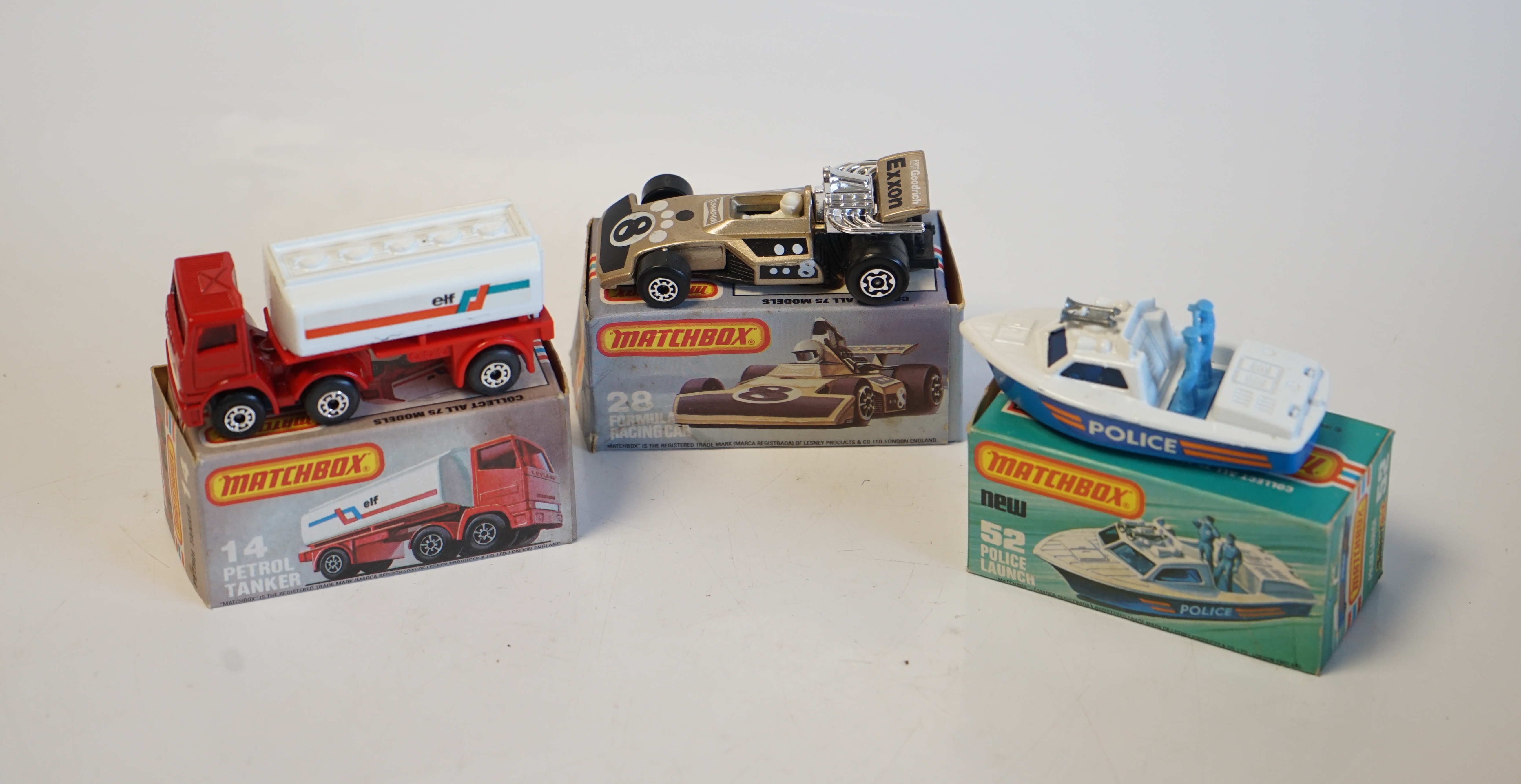 Seventeen boxed Matchbox Series 1-75 diecast vehicles including; 6; Mercedes Tourer, 9; Ford RS 2000, 10; Plymouth Police Car, 14; Petrol Tanker, 28; Formula One Racing Car and another, 30; Artic Truck, 30; Swamp Rat, 35